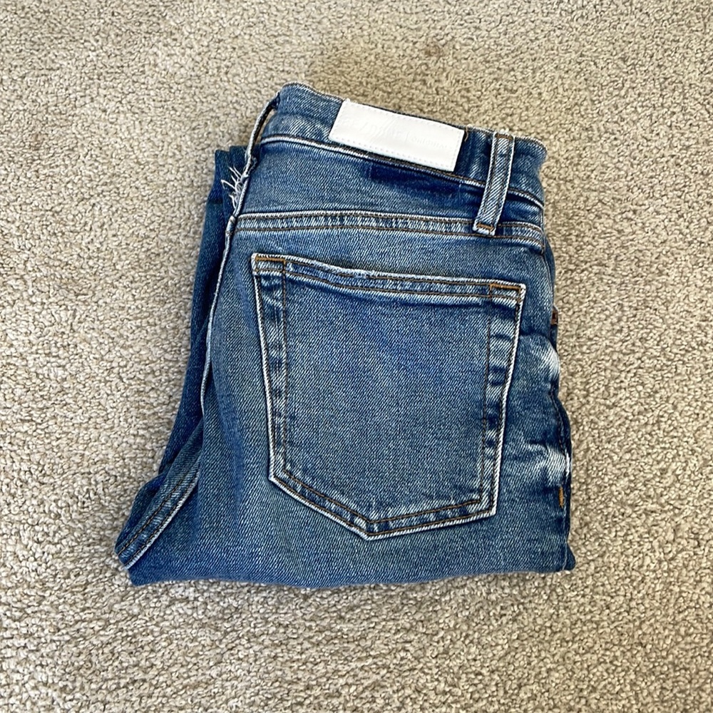 Re/done denim with raw hem and knee holes